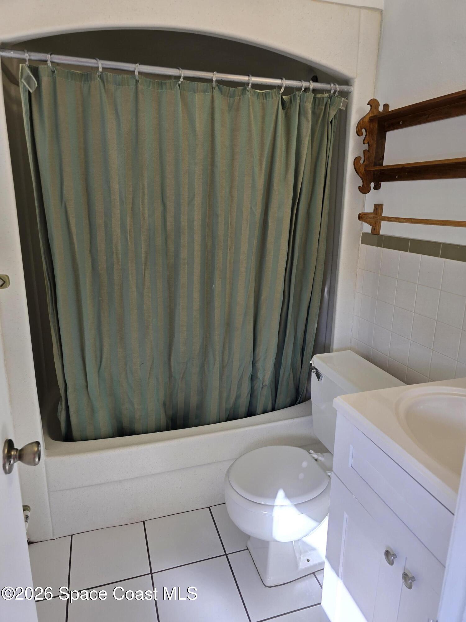 95 Lucas Road Merritt Island, FL 32953 - Photo 5 of 7 a bathroom with a shower and a tub