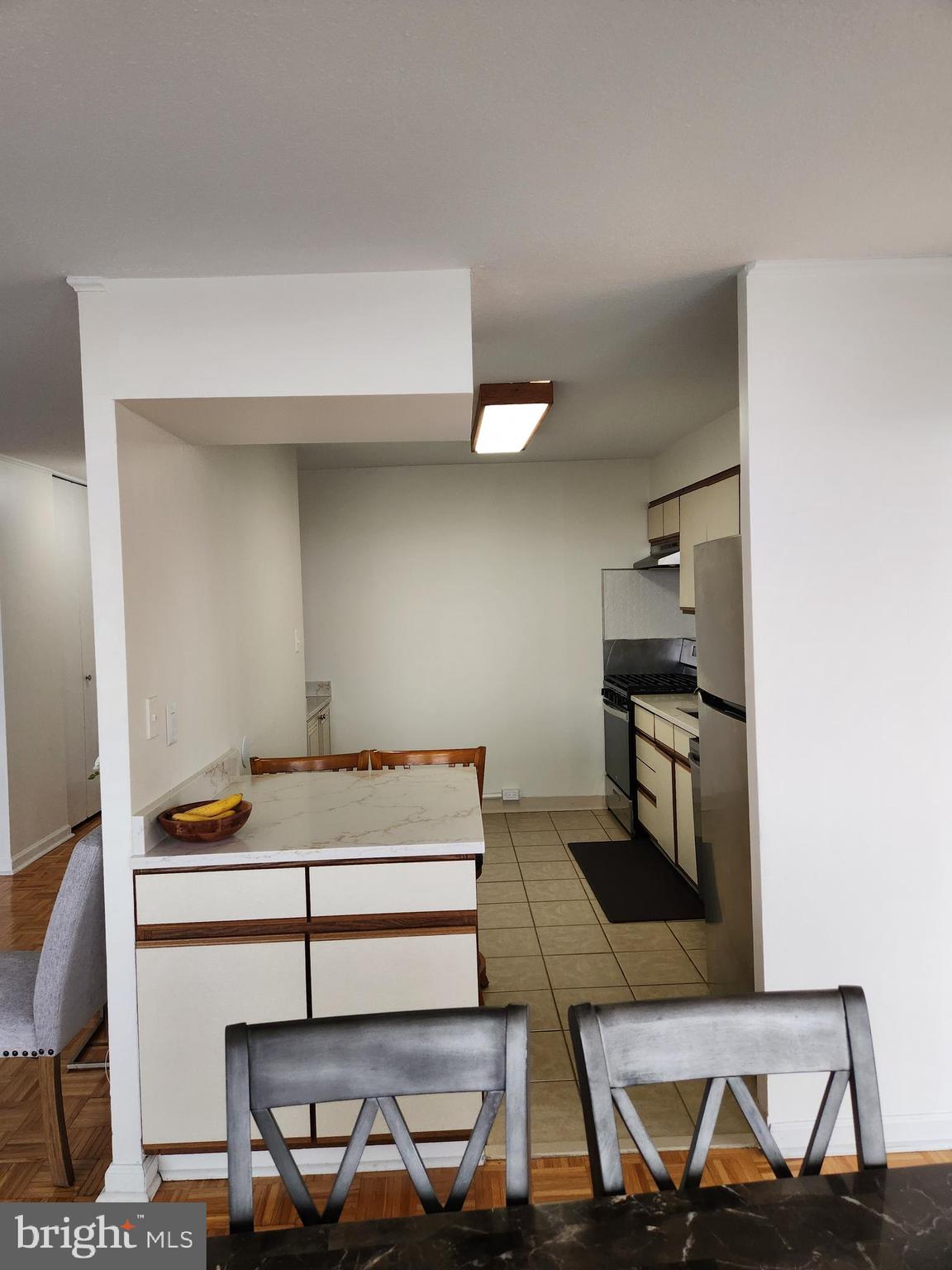 3900 West Ford Road, Unit 12A Philadelphia, PA 19131 - Photo 11 of 46 a living room with chairs and appliances