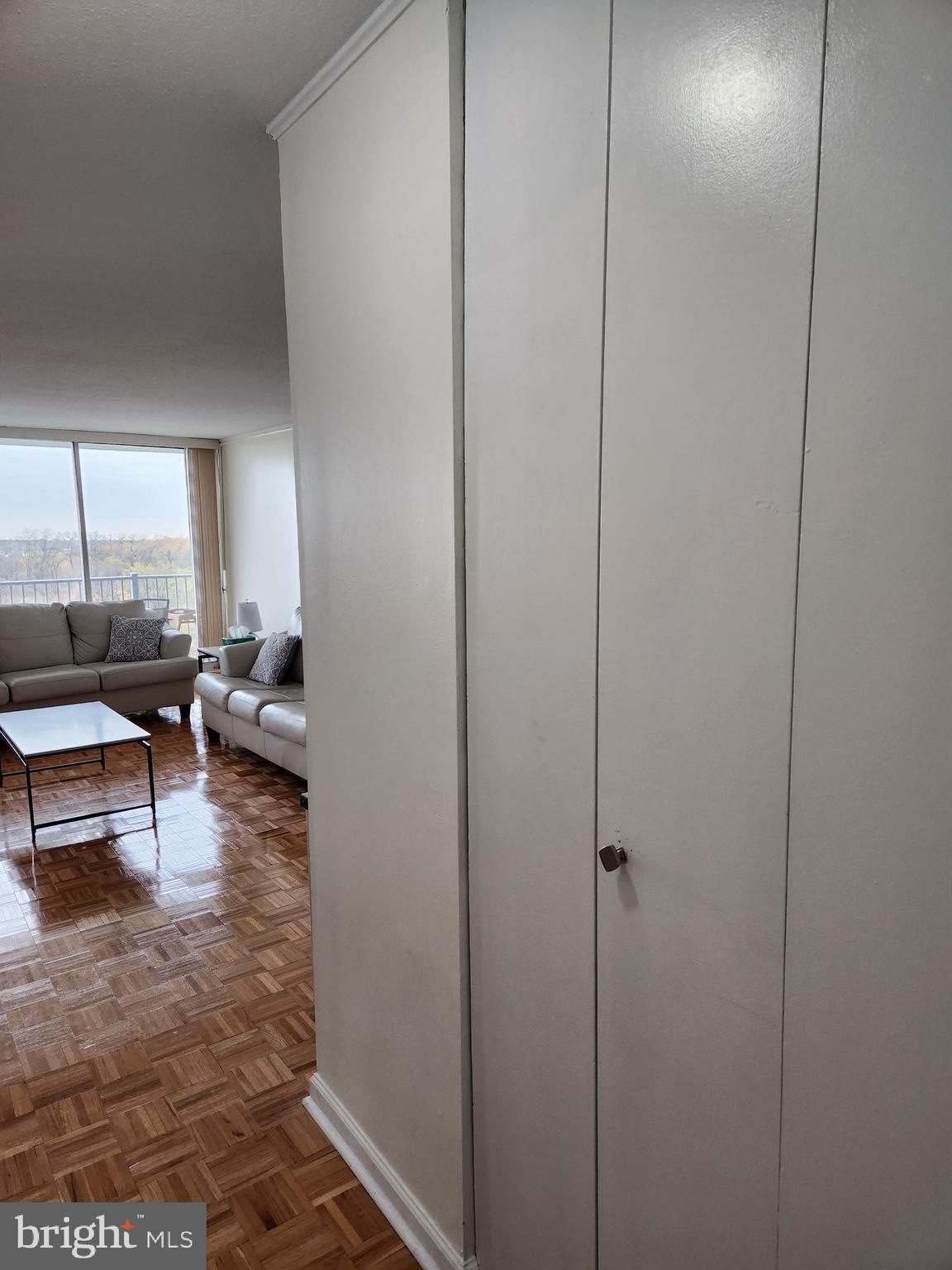 3900 West Ford Road, Unit 12A Philadelphia, PA 19131 - Photo 2 of 46 a living room with furniture and a potted plant
