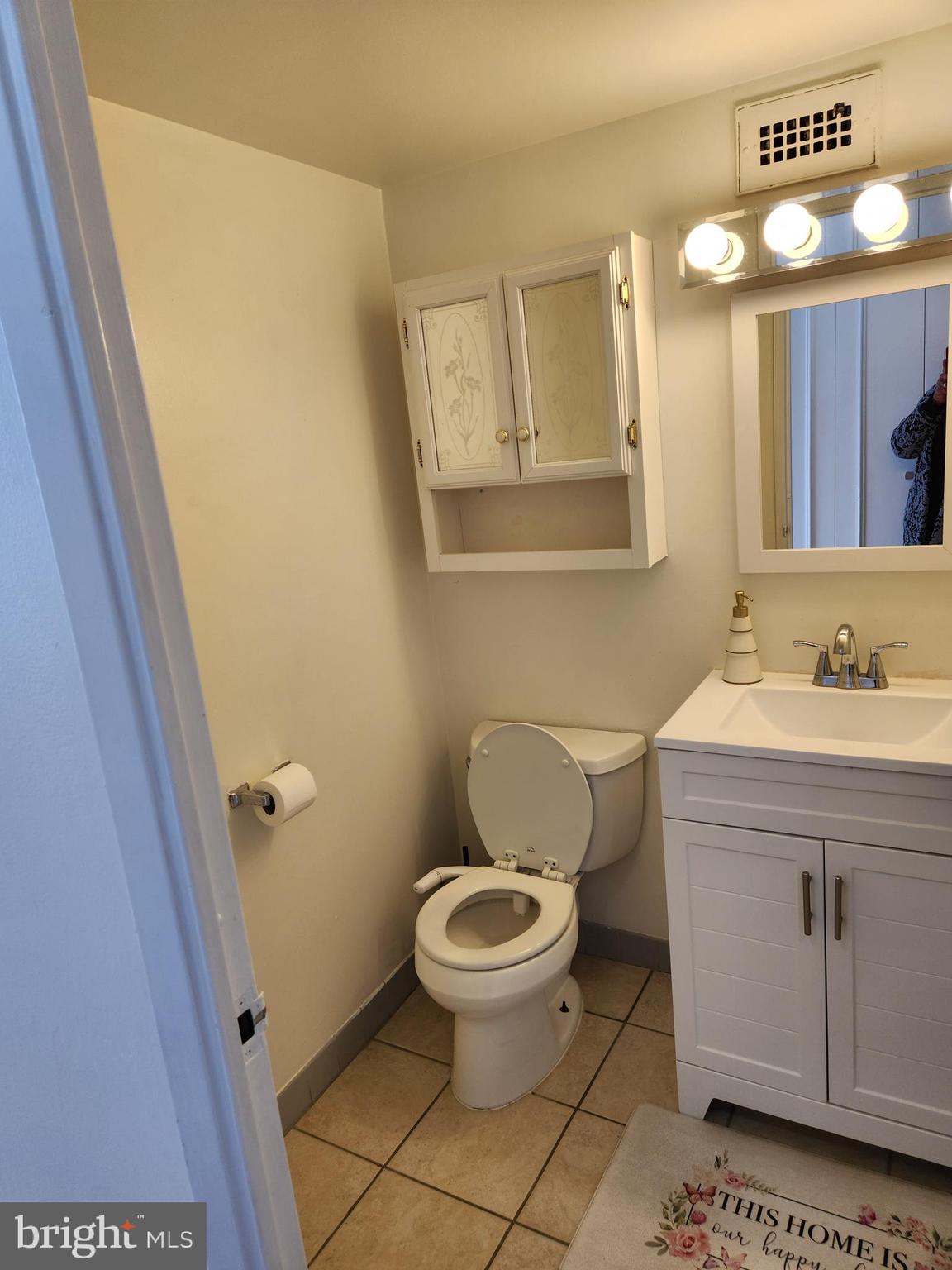 3900 West Ford Road, Unit 12A Philadelphia, PA 19131 - Photo 23 of 46 a bathroom with a sink and a mirror