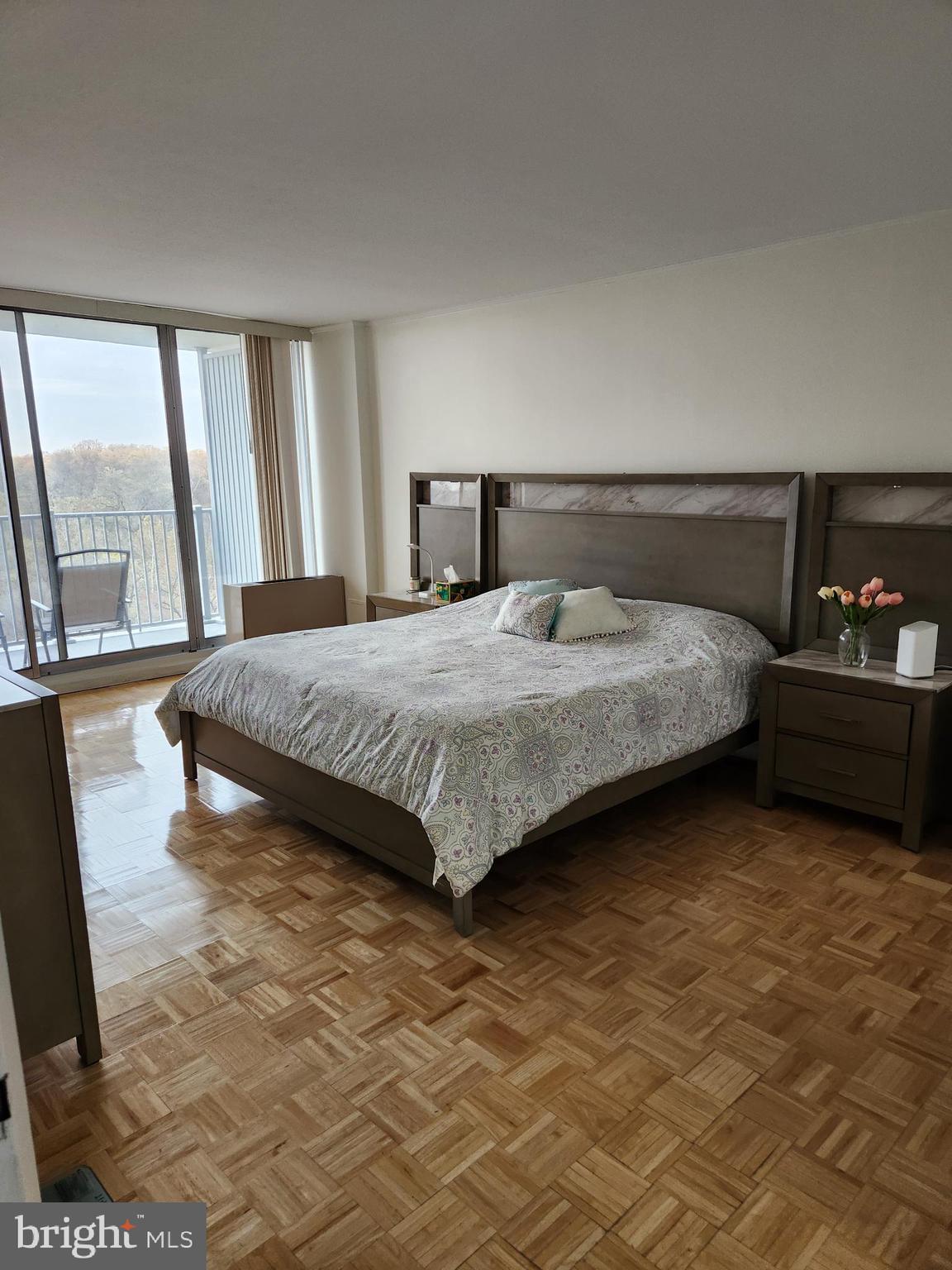 3900 West Ford Road, Unit 12A Philadelphia, PA 19131 - Photo 29 of 46 a bedroom with a bed and large windows