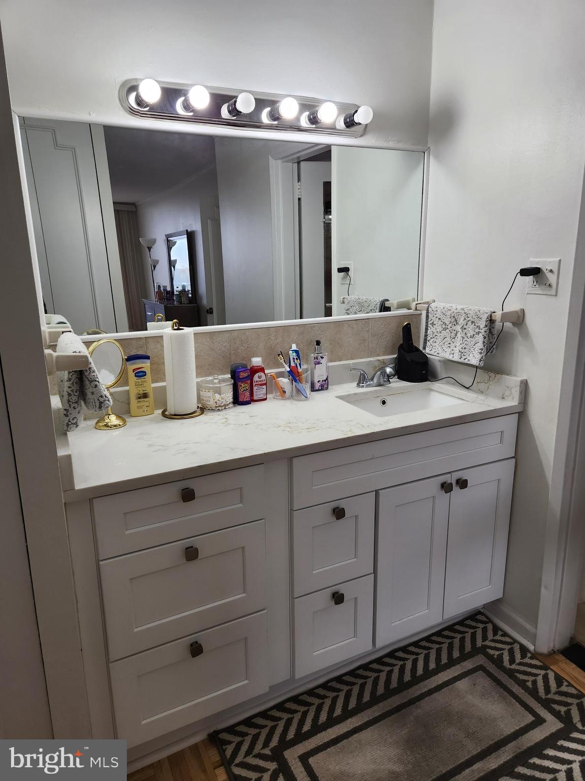 3900 West Ford Road, Unit 12A Philadelphia, PA 19131 - Photo 37 of 46 a bathroom with a sink double vanity and a mirror