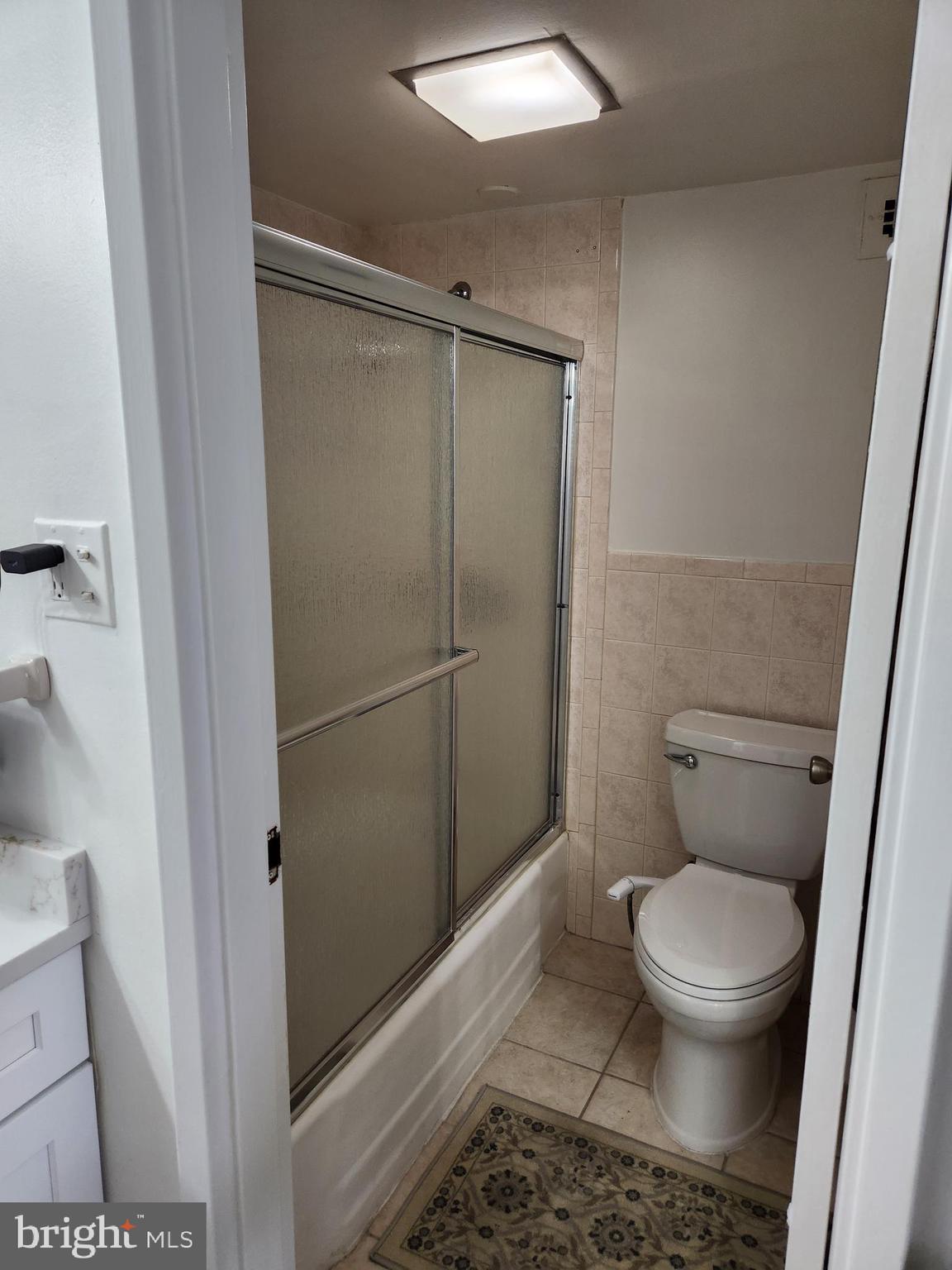 3900 West Ford Road, Unit 12A Philadelphia, PA 19131 - Photo 40 of 46 a bathroom with a toilet and a shower