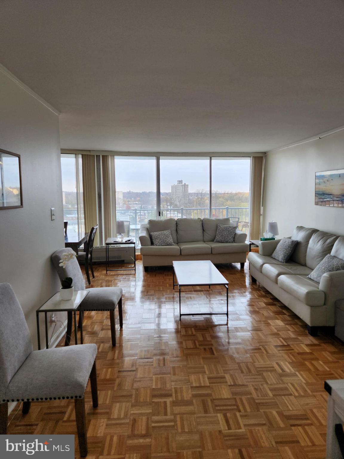 3900 West Ford Road, Unit 12A Philadelphia, PA 19131 - Photo 4 of 46 a living room with furniture and a large window