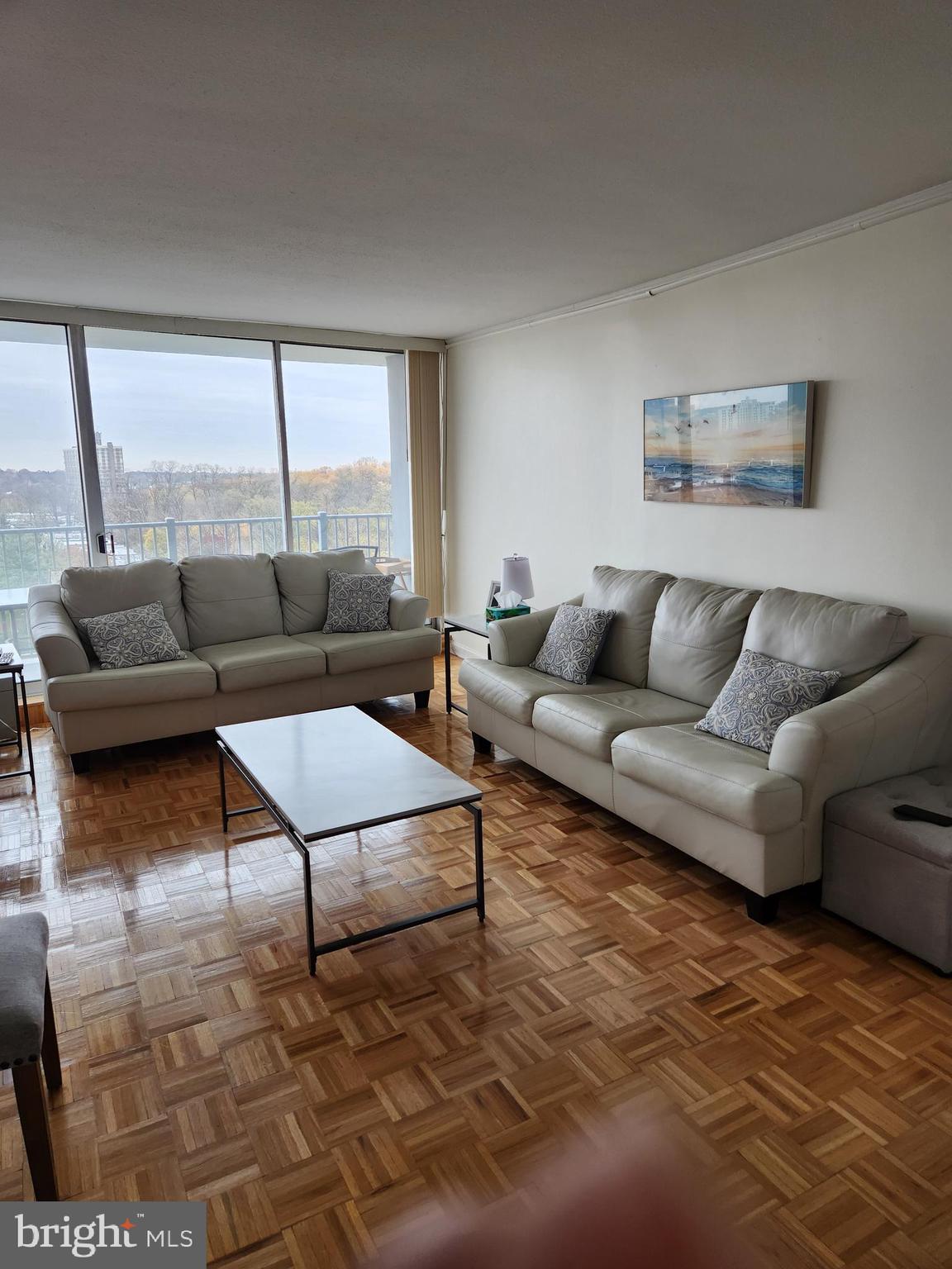 3900 West Ford Road, Unit 12A Philadelphia, PA 19131 - Photo 5 of 46 a living room with furniture and a large window