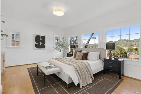 a bedroom with a bed and a couch