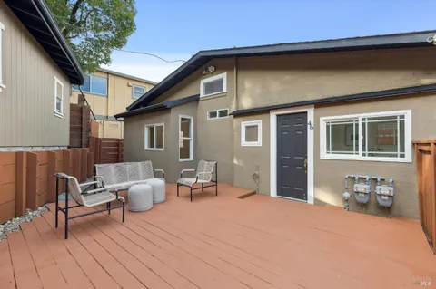 a backyard of a house with seating space