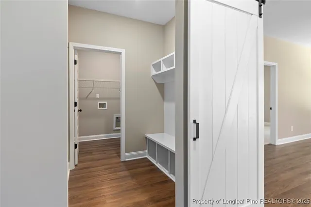 a kitchen with granite countertop white cabinets and black appliances