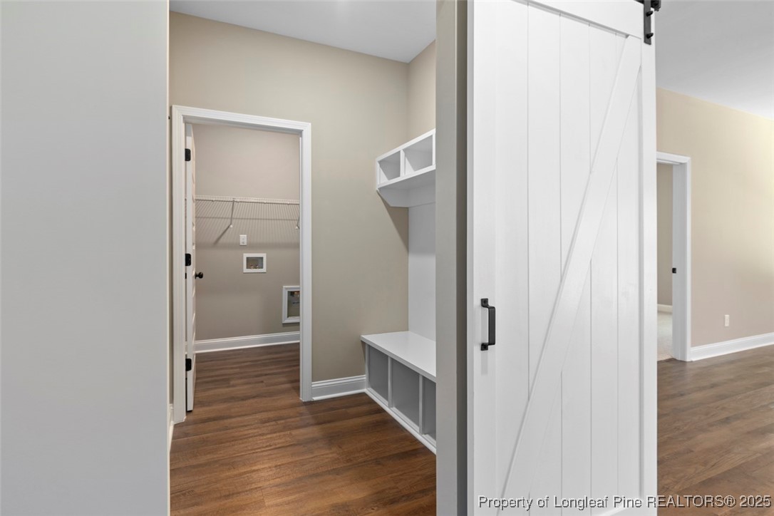 5578 Philippi Church Road Raeford, NC 28376 - Photo 11 of 33 a view of a hallway with wooden floor and staircase