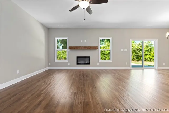 a view of walk in closet with wooden floor