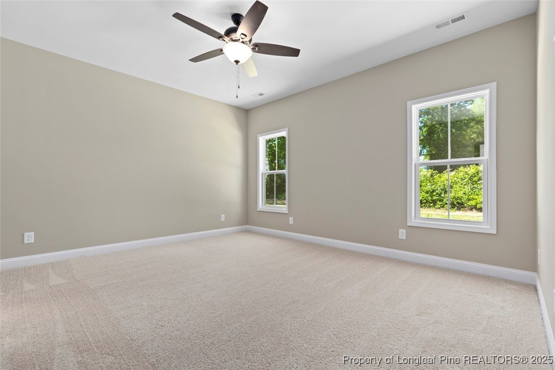 5578 Philippi Church Road Raeford, NC 28376 - Photo 21 of 33 an empty room with a window and a fan
