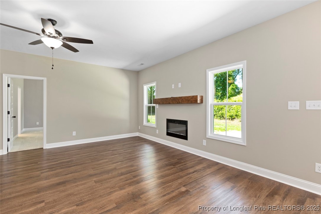 5578 Philippi Church Road Raeford, NC 28376 - Photo 22 of 33 a view of an empty room with wooden floor and a window