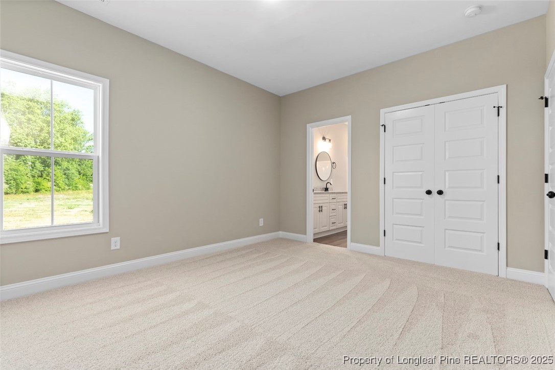 5578 Philippi Church Road Raeford, NC 28376 - Photo 25 of 33 an empty room with windows and closet
