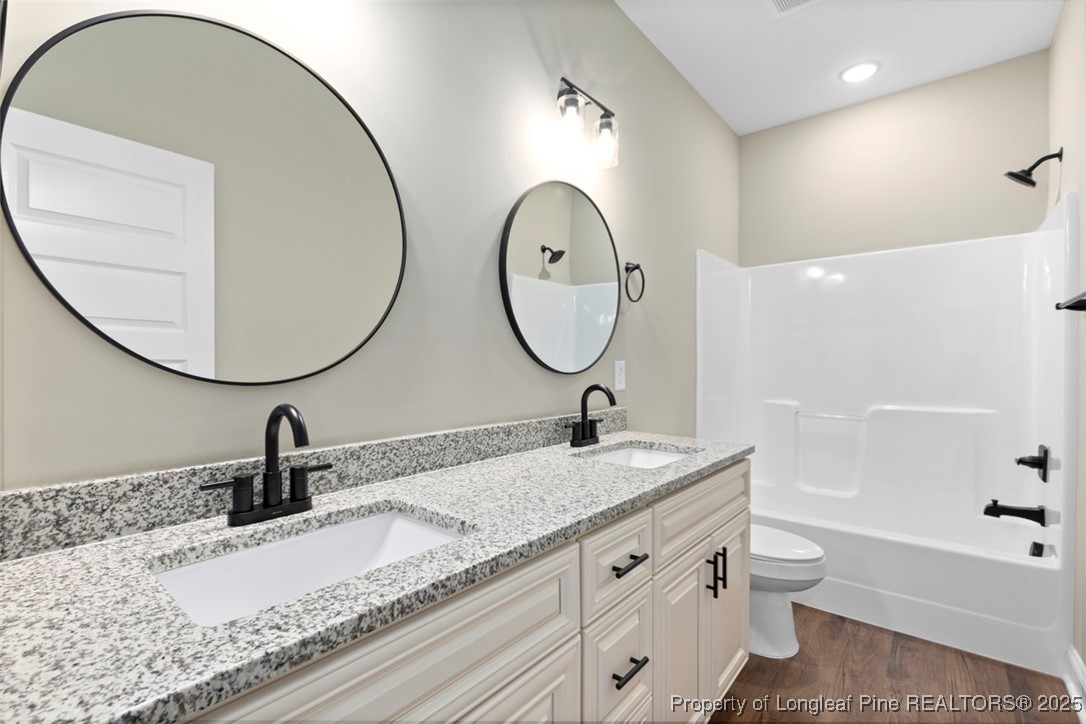 5578 Philippi Church Road Raeford, NC 28376 - Photo 26 of 33 a bathroom with a sink and a mirror