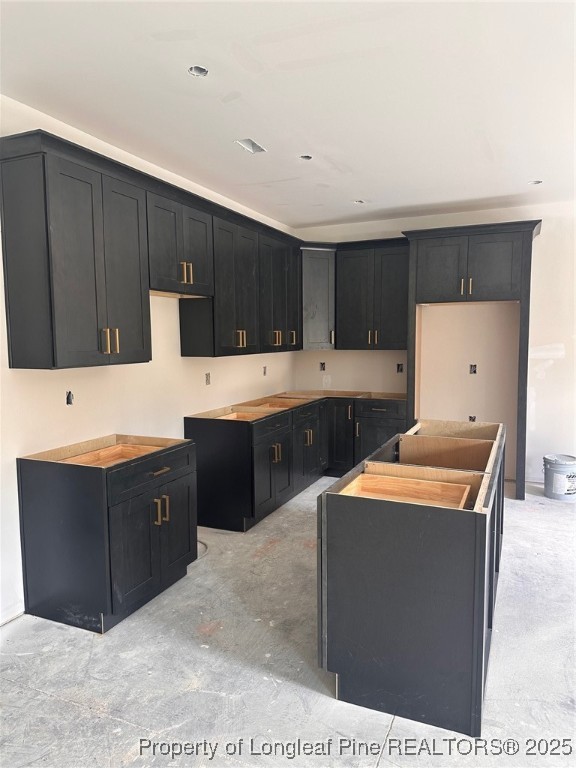 5578 Philippi Church Road Raeford, NC 28376 - Photo 8 of 33 a kitchen with stainless steel appliances kitchen island granite countertop a refrigerator a sink dishwasher and wooden cabinets