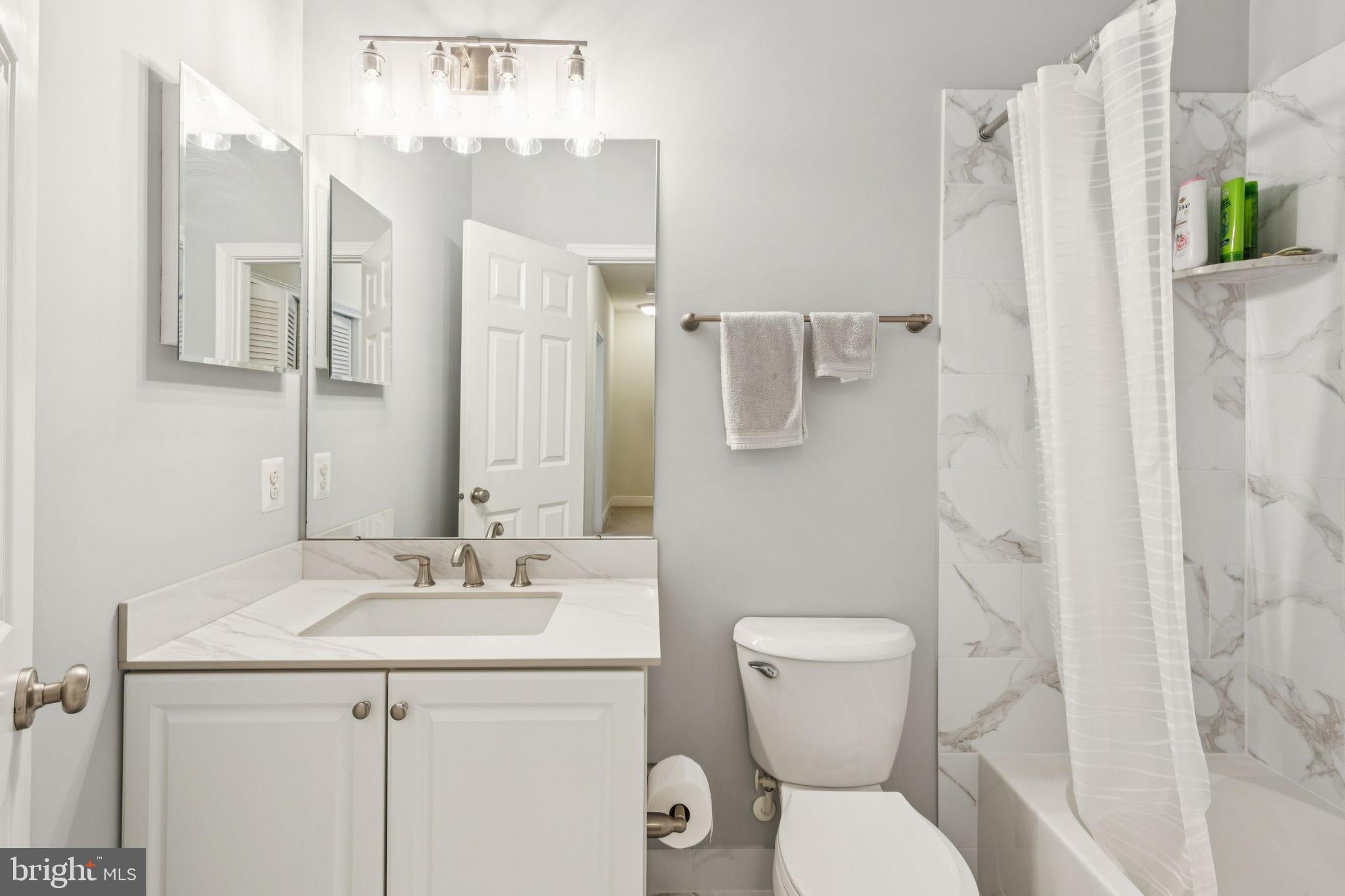 105 Commodore Court Philadelphia, PA 19146 - Photo 17 of 26 a bathroom with a toilet sink and shower