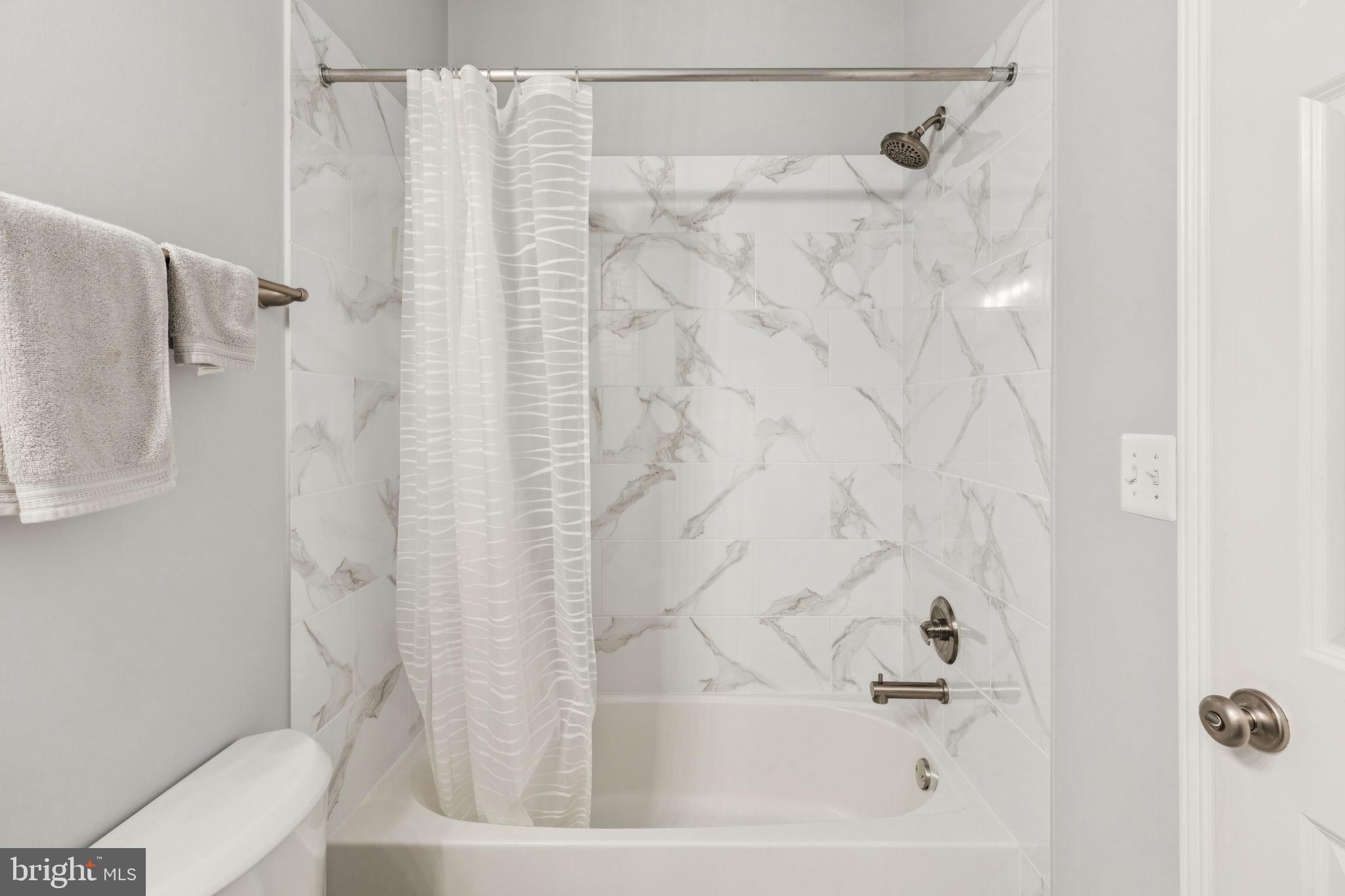 105 Commodore Court Philadelphia, PA 19146 - Photo 18 of 26 a bathroom with a bathtub and shower