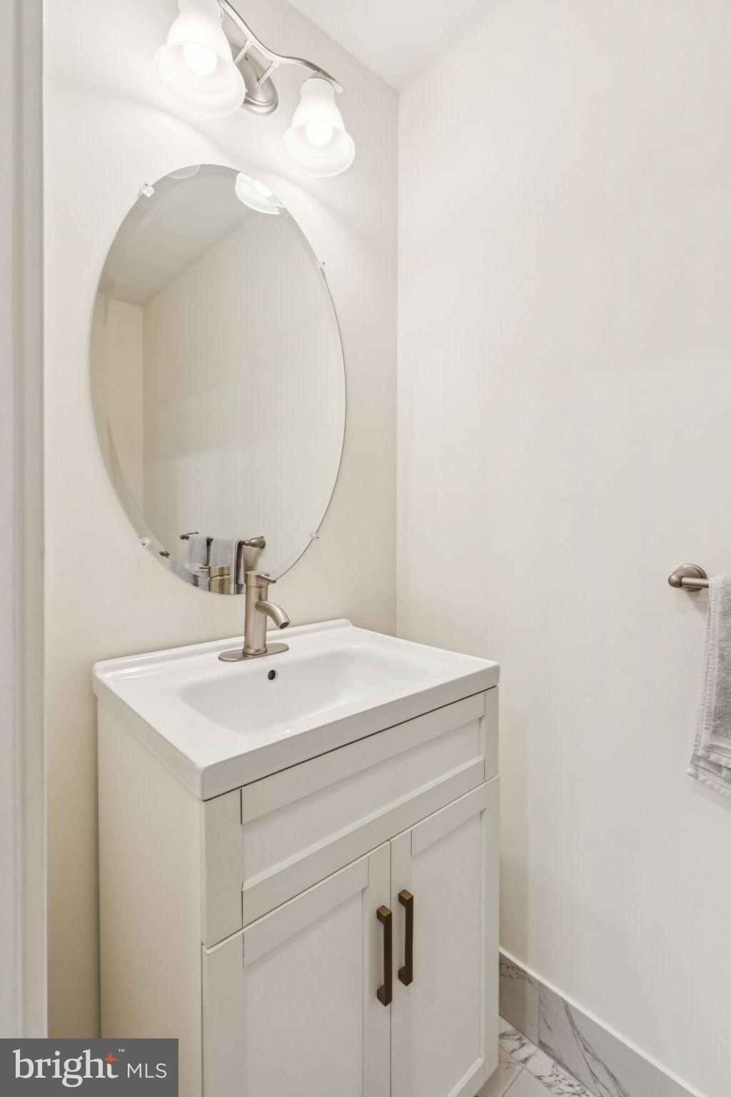 105 Commodore Court Philadelphia, PA 19146 - Photo 10 of 26 a bathroom with a sink and mirror