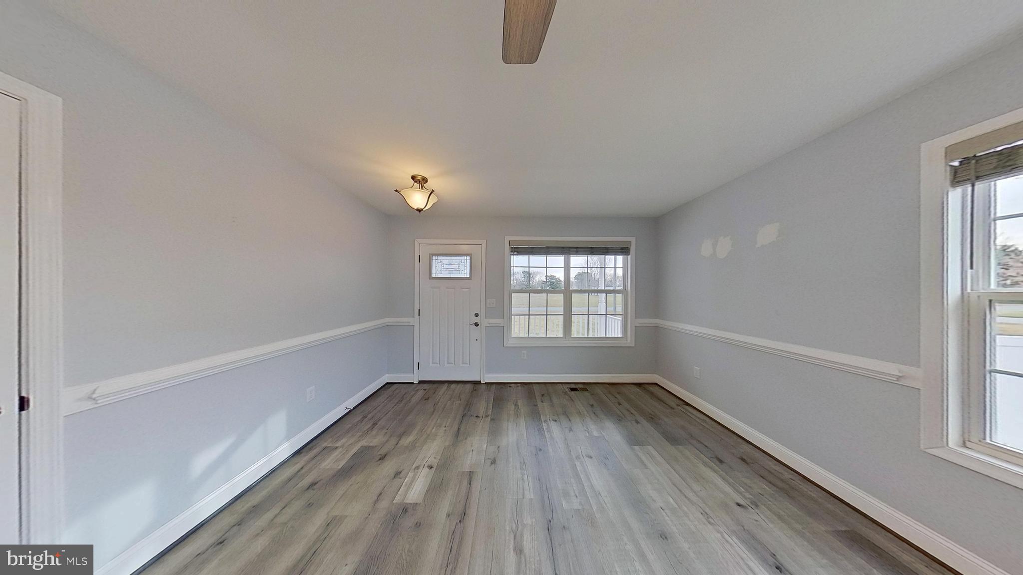 95 Rolando Drive Colonial Beach, VA 22443 - Photo 22 of 39 wooden floor in an empty room with a window