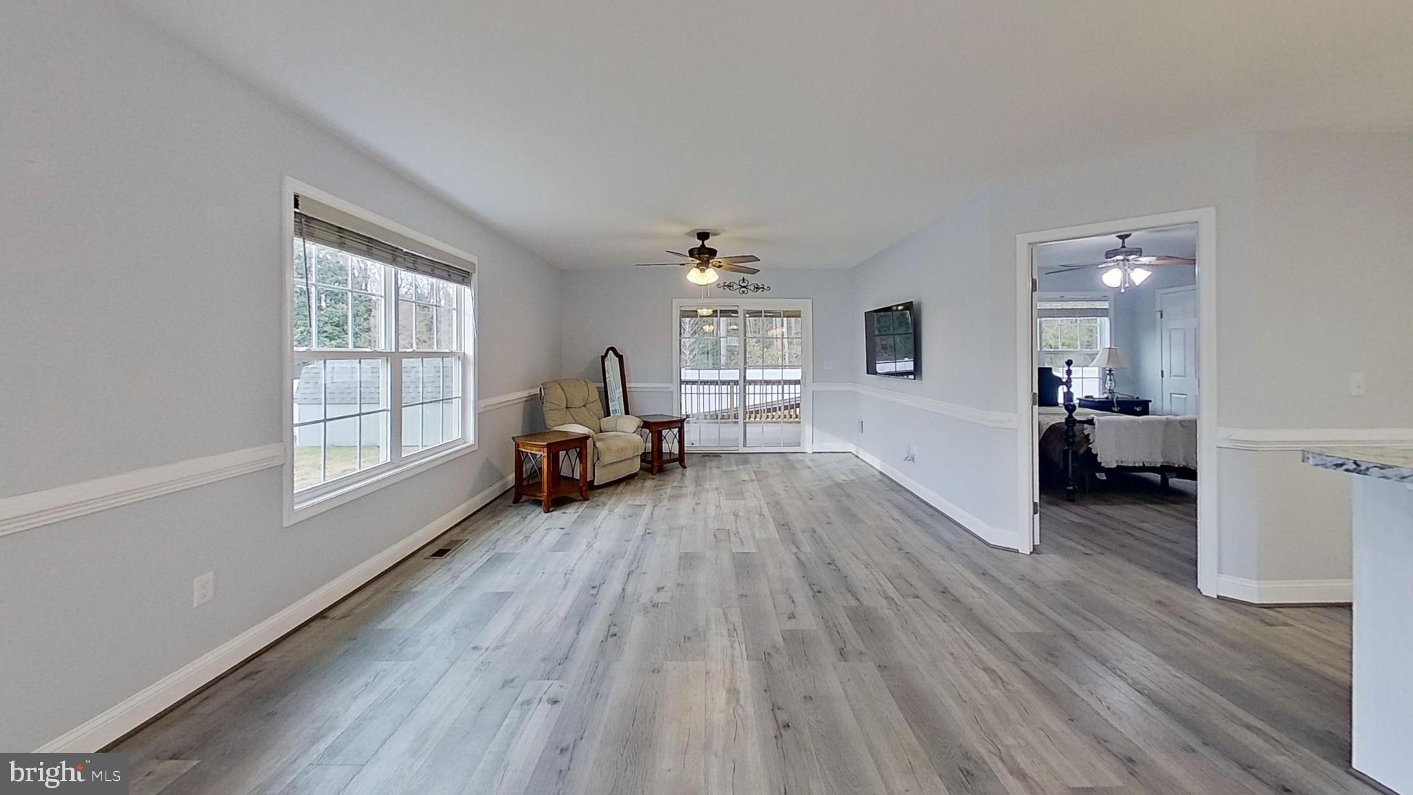 95 Rolando Drive Colonial Beach, VA 22443 - Photo 23 of 39 a living room with furniture and a wooden floor