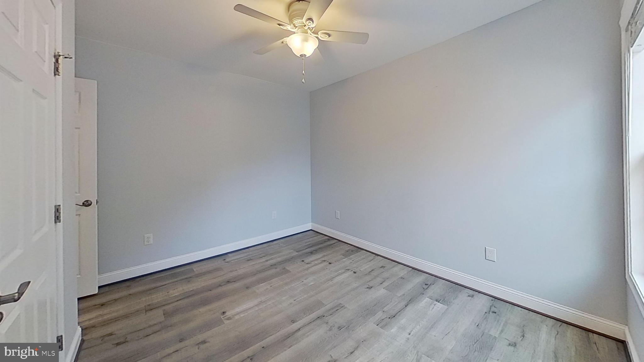 95 Rolando Drive Colonial Beach, VA 22443 - Photo 28 of 39 a view of an empty room with wooden floor