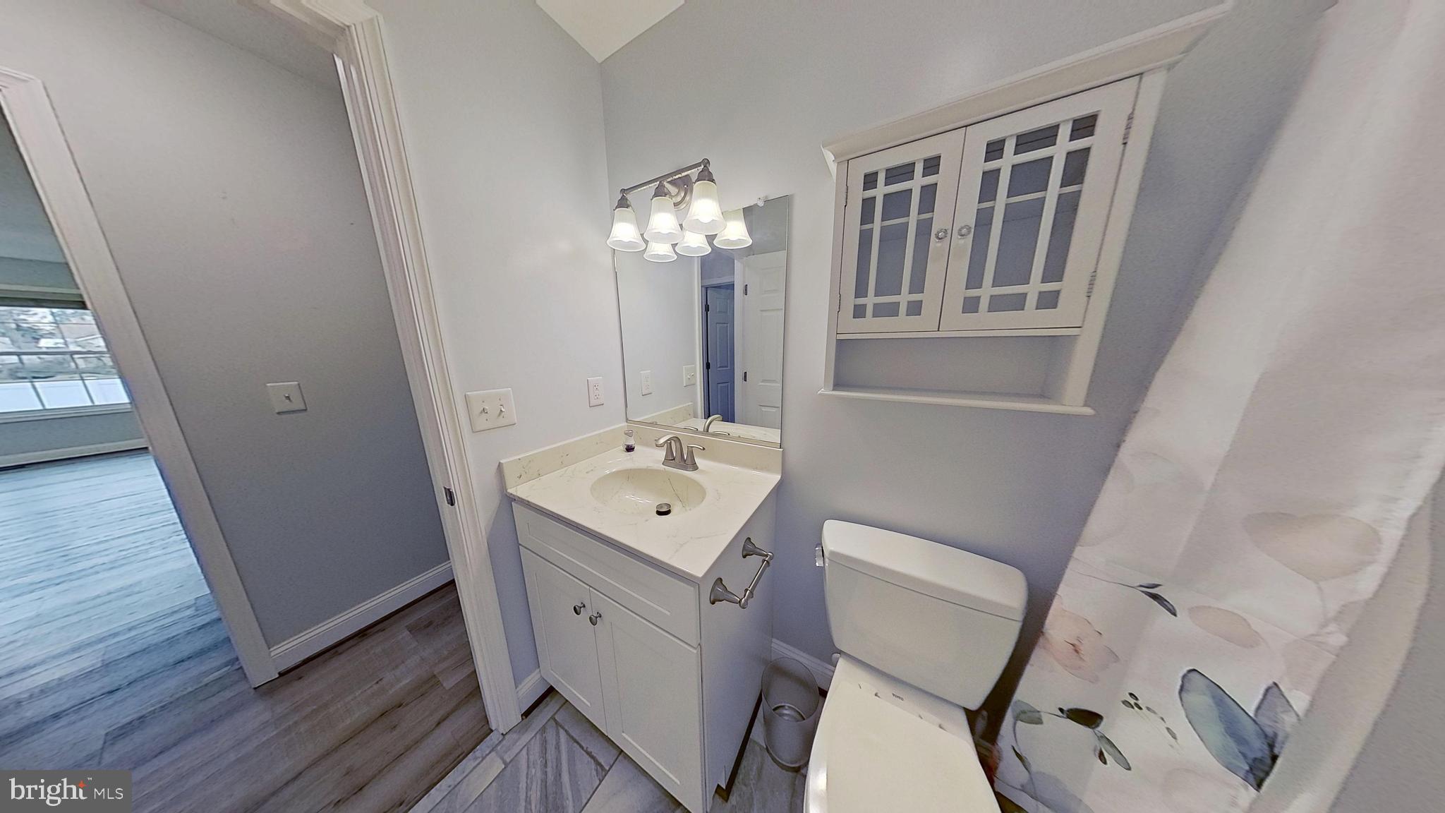 95 Rolando Drive Colonial Beach, VA 22443 - Photo 34 of 39 a view of a hallway with furniture and wooden floor