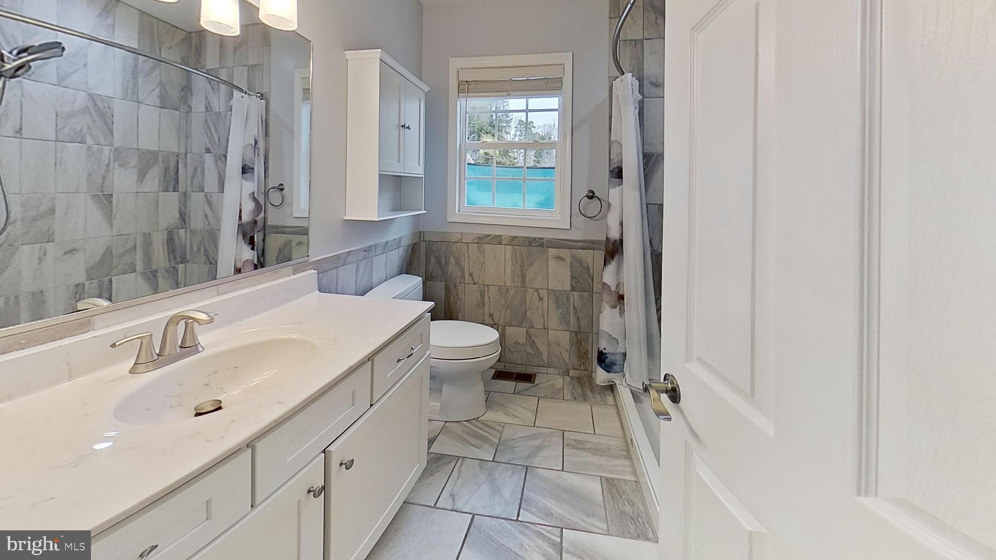 95 Rolando Drive Colonial Beach, VA 22443 - Photo 36 of 39 a bathroom with a sink toilet and shower