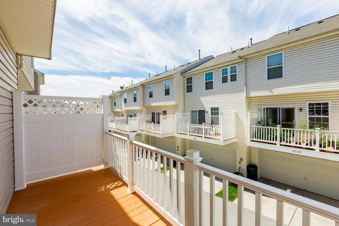 8042 Wright Place, Unit 103 Jessup, MD 20794 - Photo 11 of 22 a view of a building from a balcony