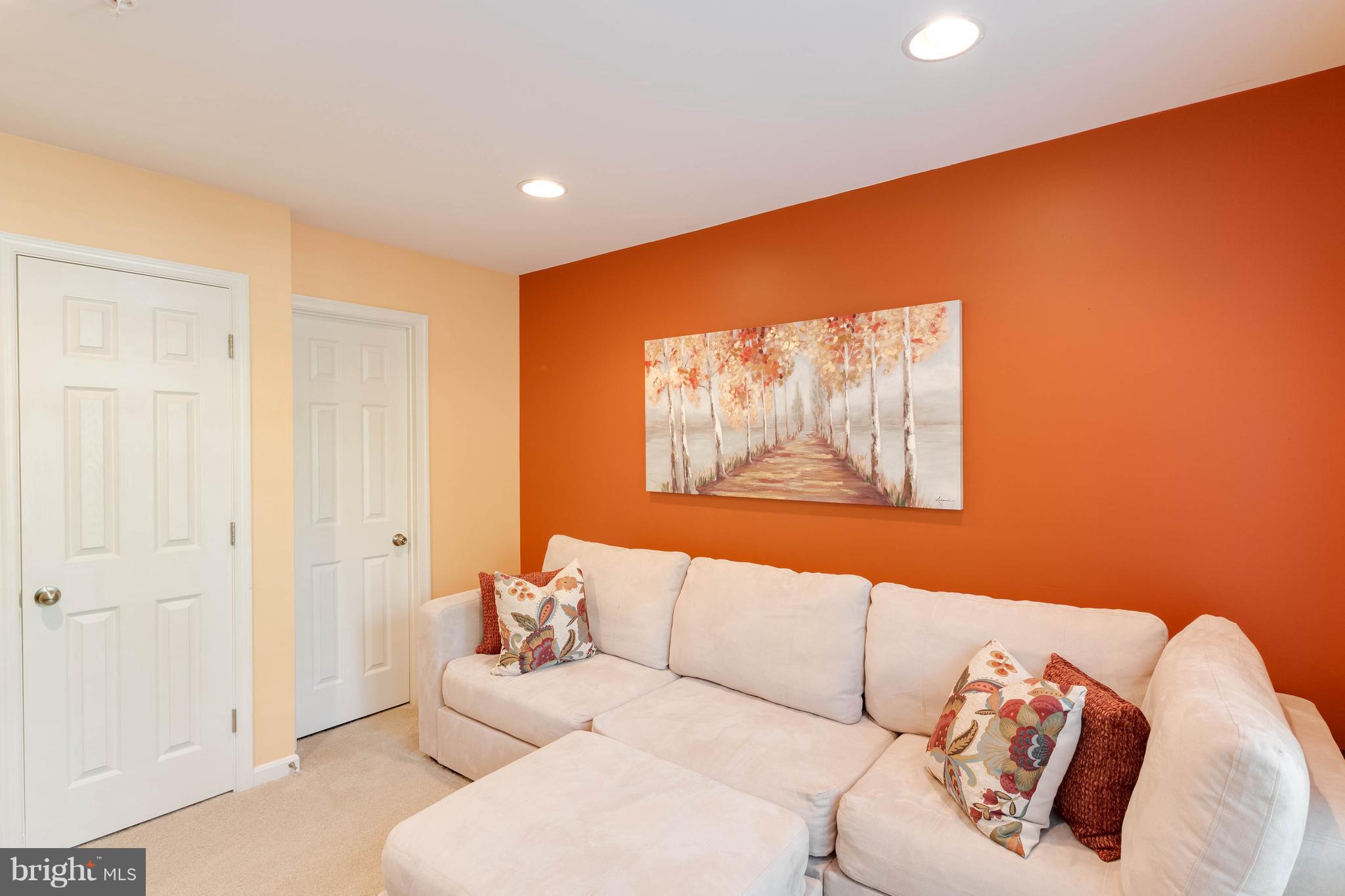 8042 Wright Place, Unit 103 Jessup, MD 20794 - Photo 21 of 22 a living room with furniture and a large window
