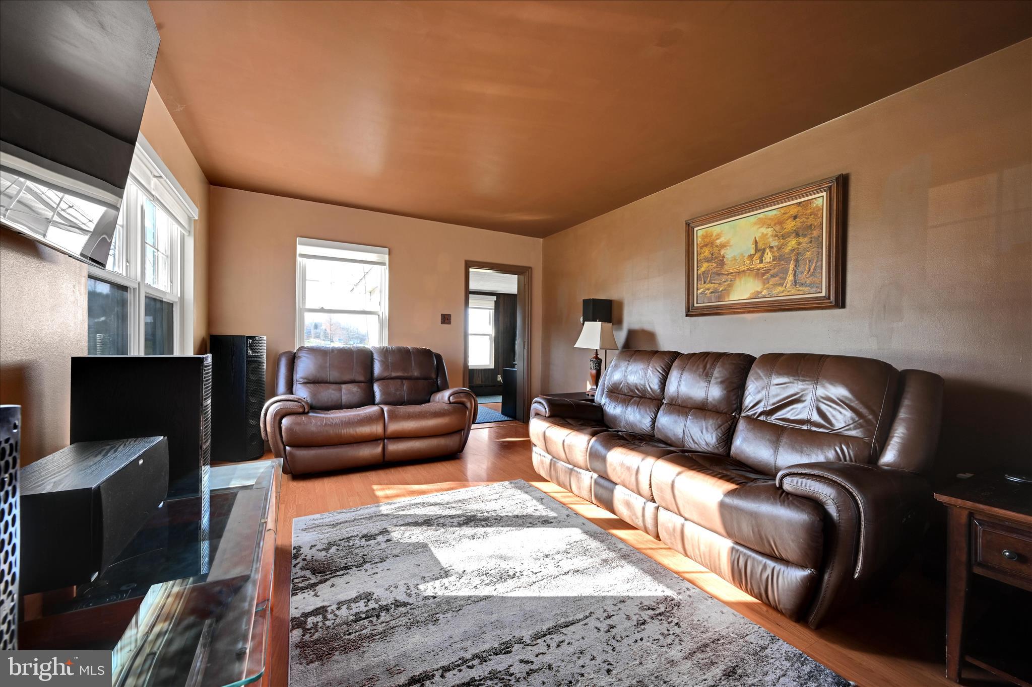 401 Park Road Fleetwood, PA 19522 - Photo 17 of 47 a living room with furniture and a flat screen tv