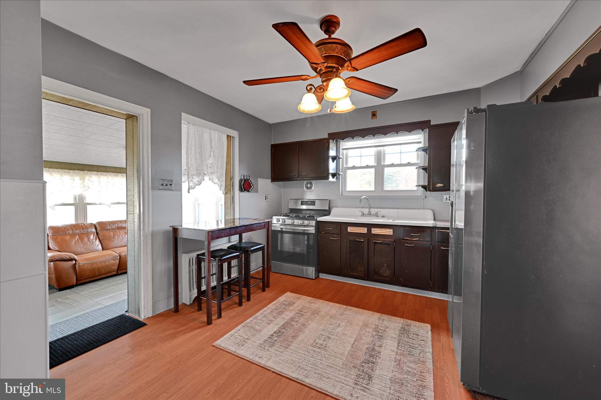 401 Park Road Fleetwood, PA 19522 - Photo 22 of 47 a kitchen with stainless steel appliances granite countertop sink stove top oven and cabinets