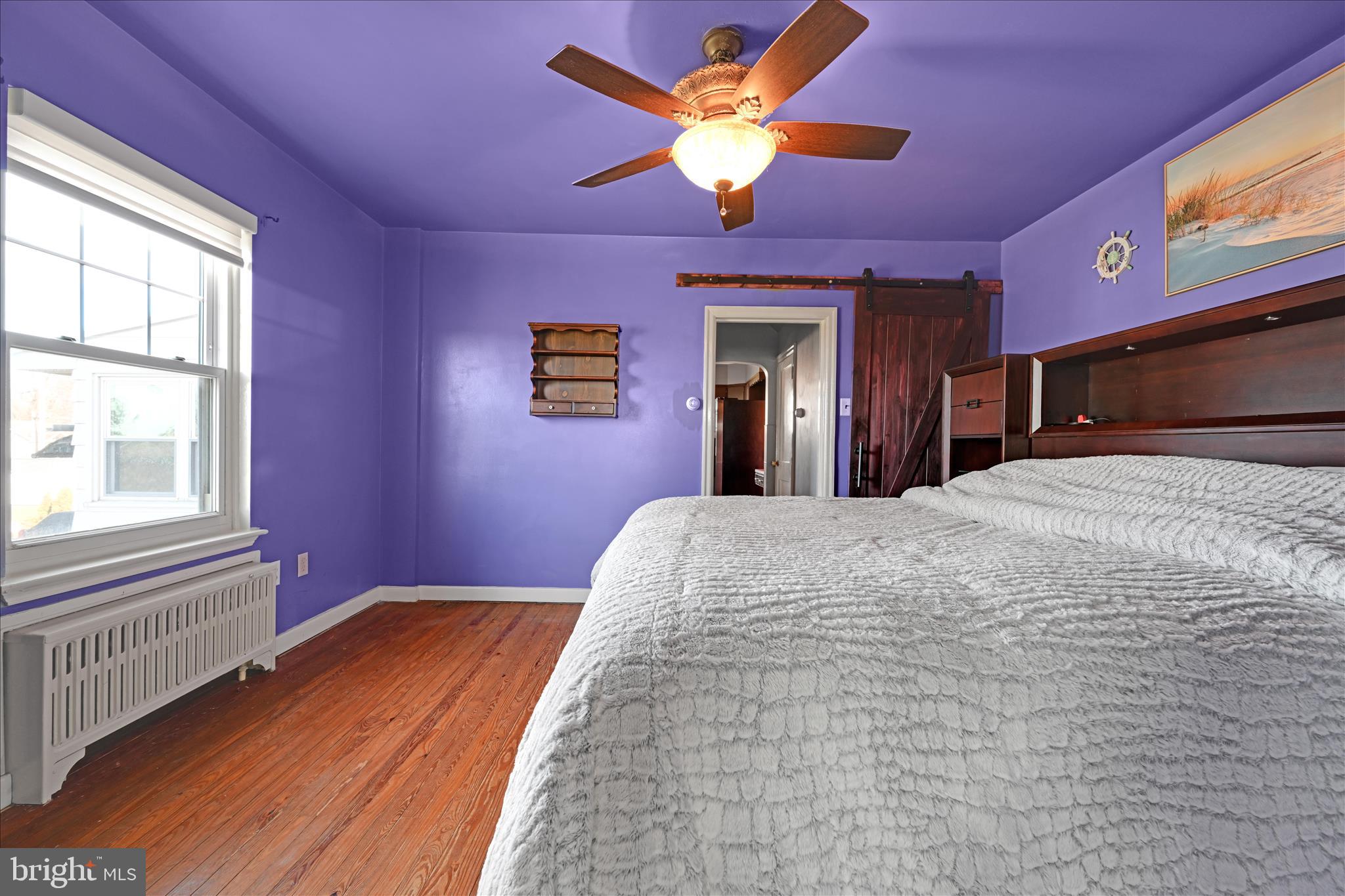 401 Park Road Fleetwood, PA 19522 - Photo 32 of 47 a bedroom with a bed chandelier and a window