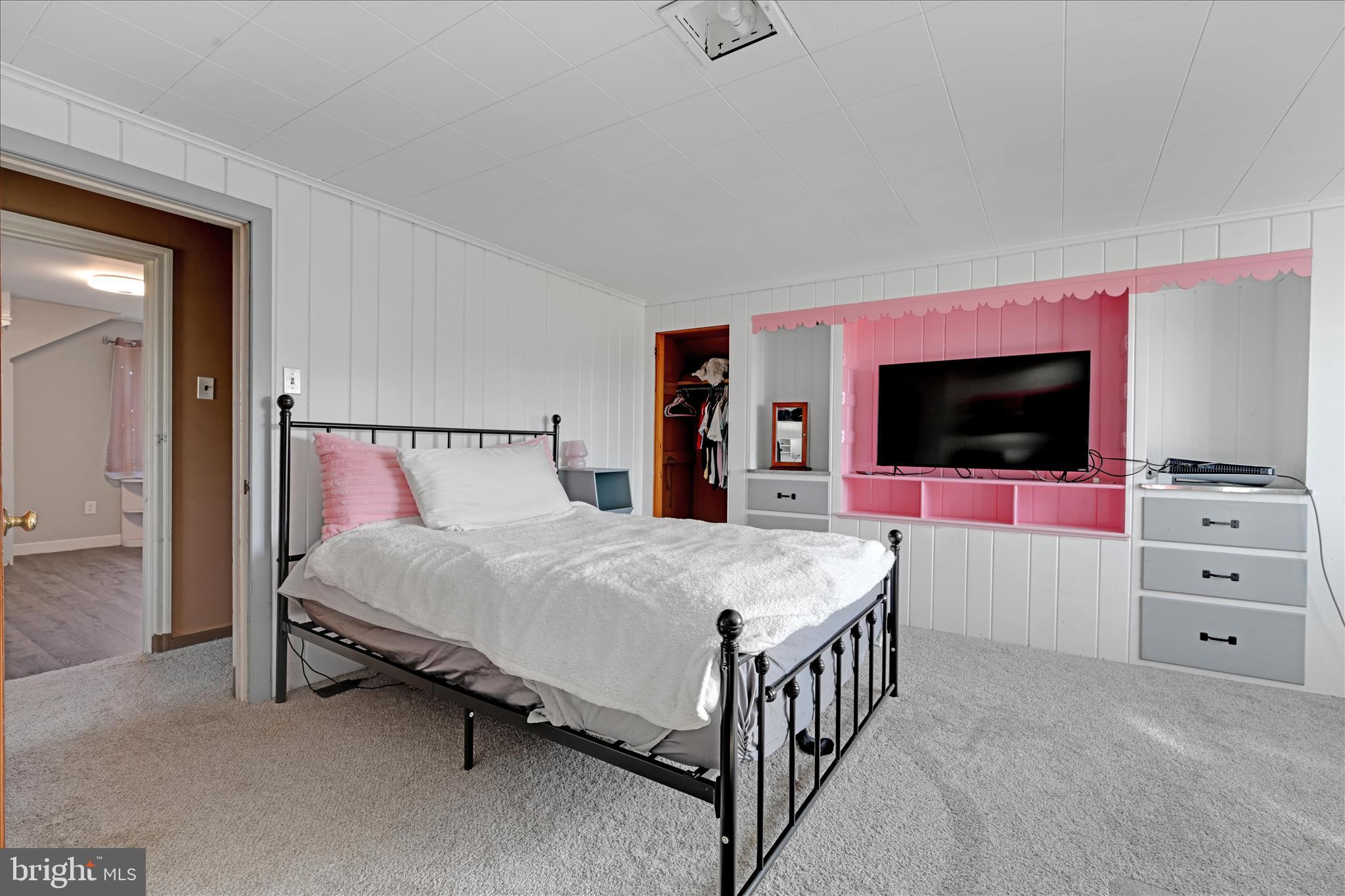 401 Park Road Fleetwood, PA 19522 - Photo 37 of 47 a bedroom with a bed and a flat screen tv