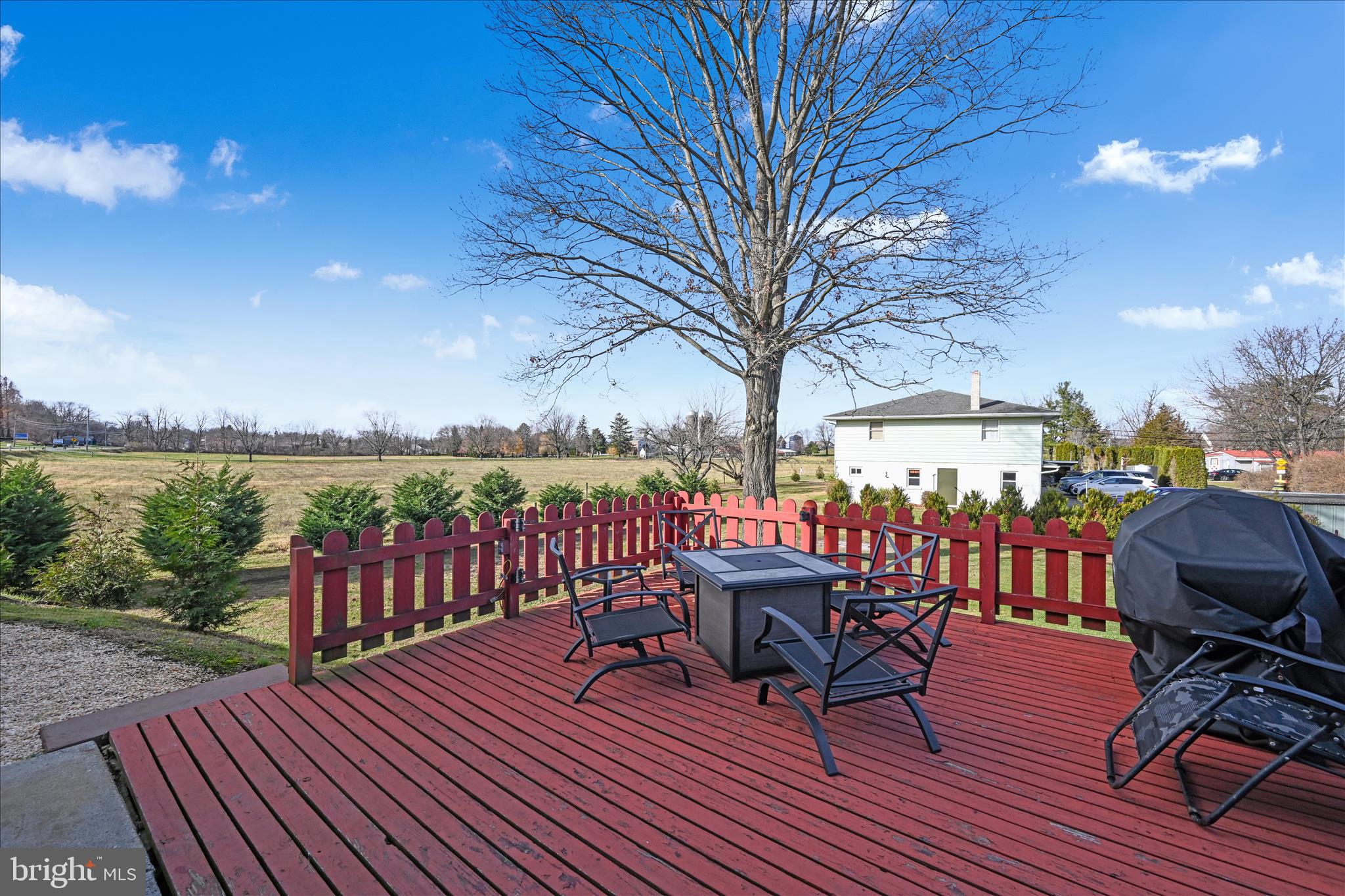 401 Park Road Fleetwood, PA 19522 - Photo 40 of 47 a view of a roof deck with table and chairs a barbeque with wooden floor and fence