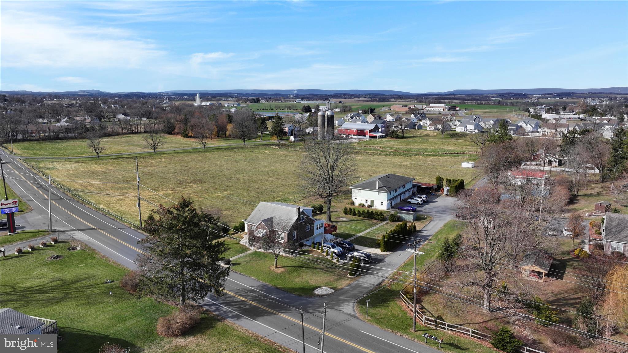 401 Park Road Fleetwood, PA 19522 - Photo 8 of 47 an aerial view of a house with a garden and lake view