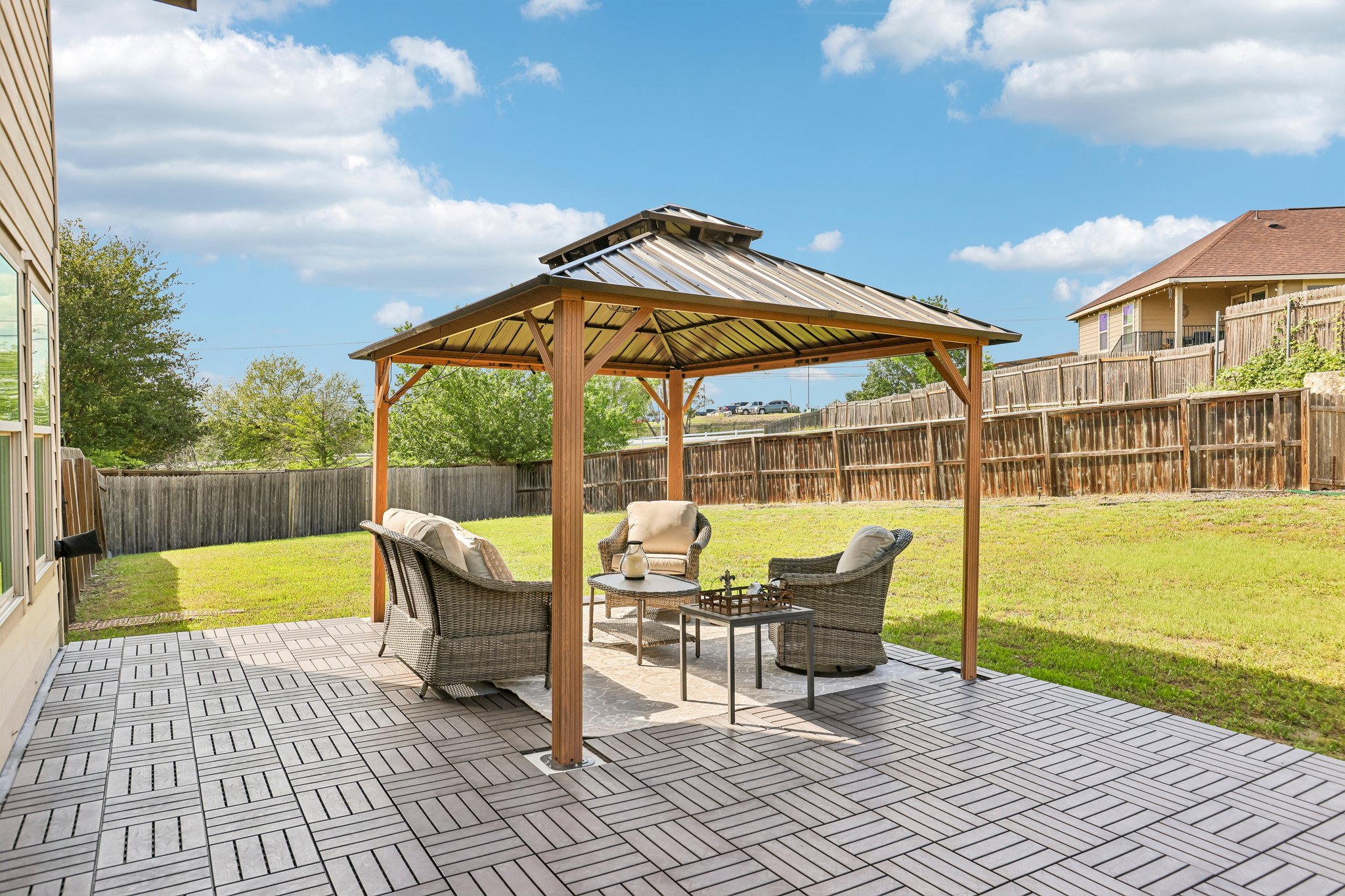 5508 Emma Thompson Way Austin, TX 78747 - Photo 3 of 34 Stunning outdoor deck and pergola create the perfect setting for entertaining, relaxing, and enjoying the expansive backyard while taking in beautiful sunset views.