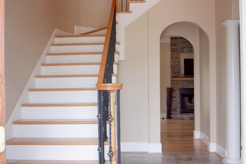 4801 Fox Chase Road Greensboro, NC 27410 - Photo 2 of 30 Staircase with iron detailing. Curved entrance to family room.