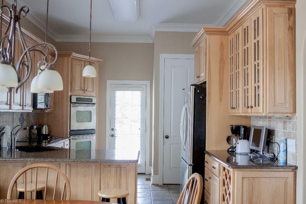 4801 Fox Chase Road Greensboro, NC 27410 - Photo 12 of 30 Pretty, light colored cabinets in kitchen.