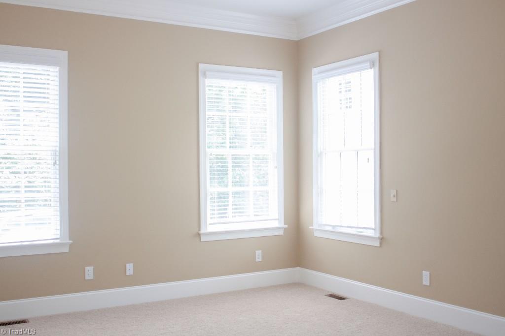 4801 Fox Chase Road Greensboro, NC 27410 - Photo 14 of 30 Tall windows make for a spacious and airy feeling..