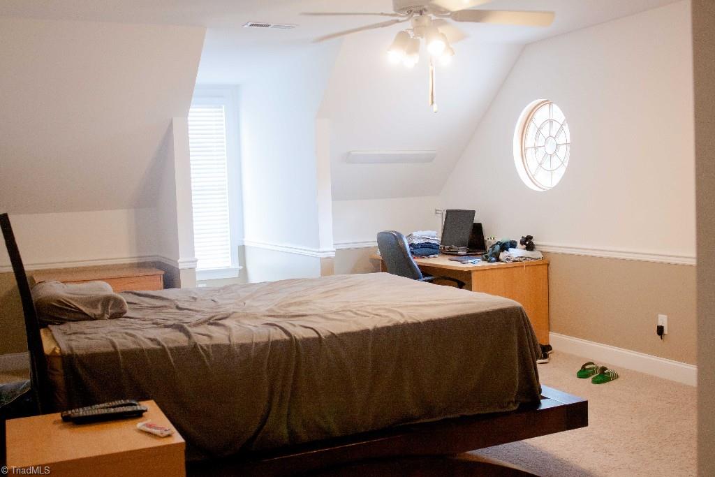 4801 Fox Chase Road Greensboro, NC 27410 - Photo 22 of 30 Bedroom #2, upstairs. Circular window adds architectural interest.