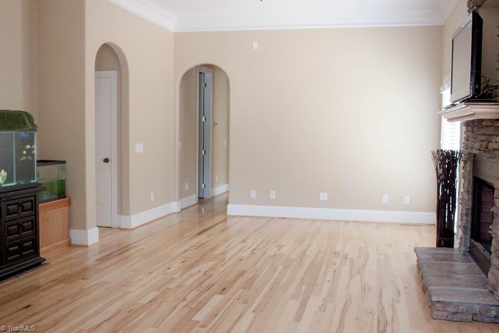 4801 Fox Chase Road Greensboro, NC 27410 - Photo 8 of 30 Family room with curved doorways and fireplace.