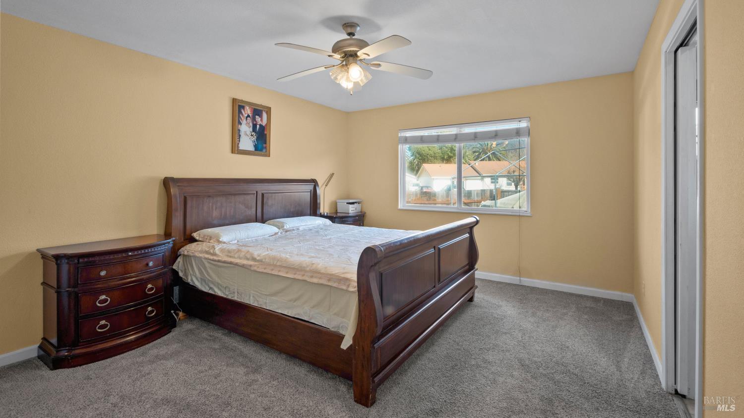 5036 Algiers Avenue Santa Rosa, CA 95409 - Photo 14 of 34 a bed sitting in a bedroom next to a window