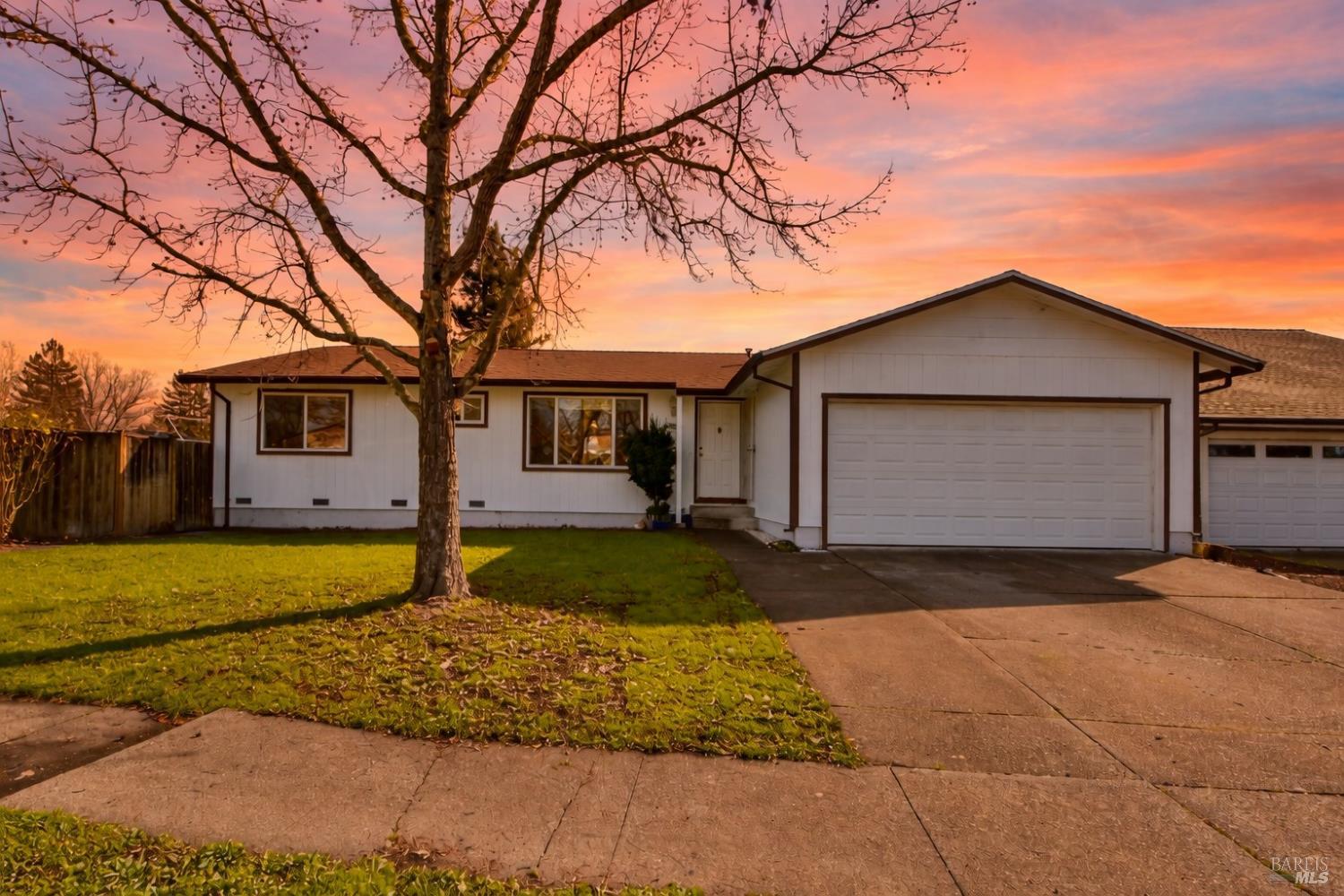 5036 Algiers Avenue Santa Rosa, CA 95409 - Photo 2 of 34 a front view of a house with a yard and garage