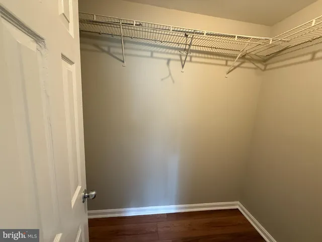 a view of a room with racks on the wall