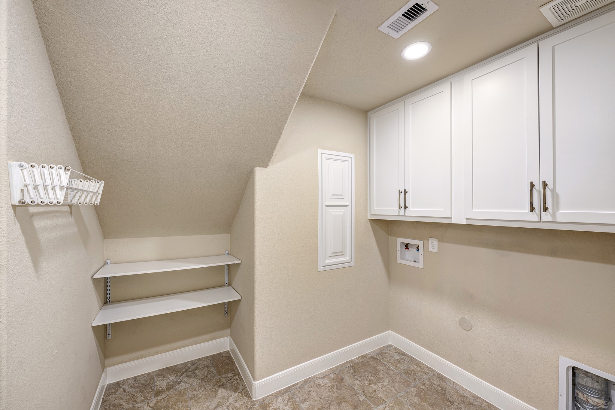 11 Red Wagon Drive Spring, TX 77389 - Photo 13 of 32 The laundry room includes custom storage cabinets and a PEX manifold access panel.