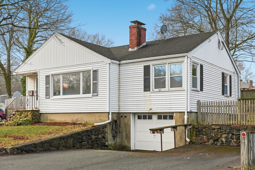 9 Pinewood Avenue Beverly, MA 01915 - Photo 1 of 41 a front view of a house with a garage