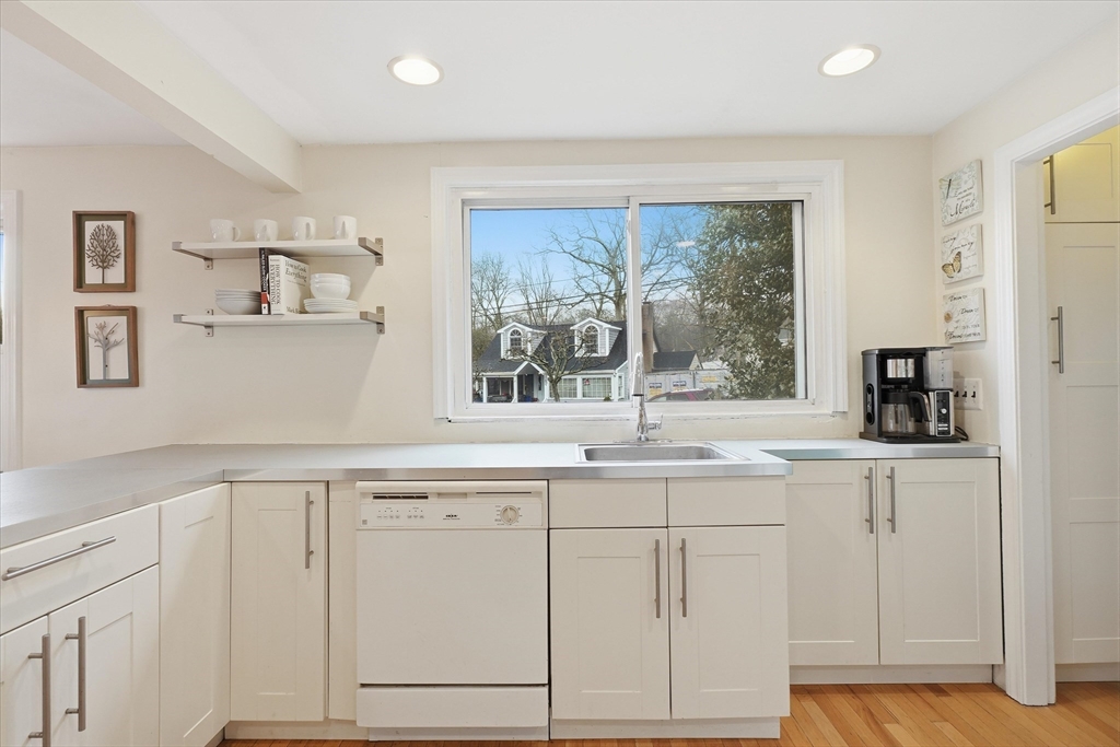 9 Pinewood Avenue Beverly, MA 01915 - Photo 13 of 41 a kitchen with white cabinets and window