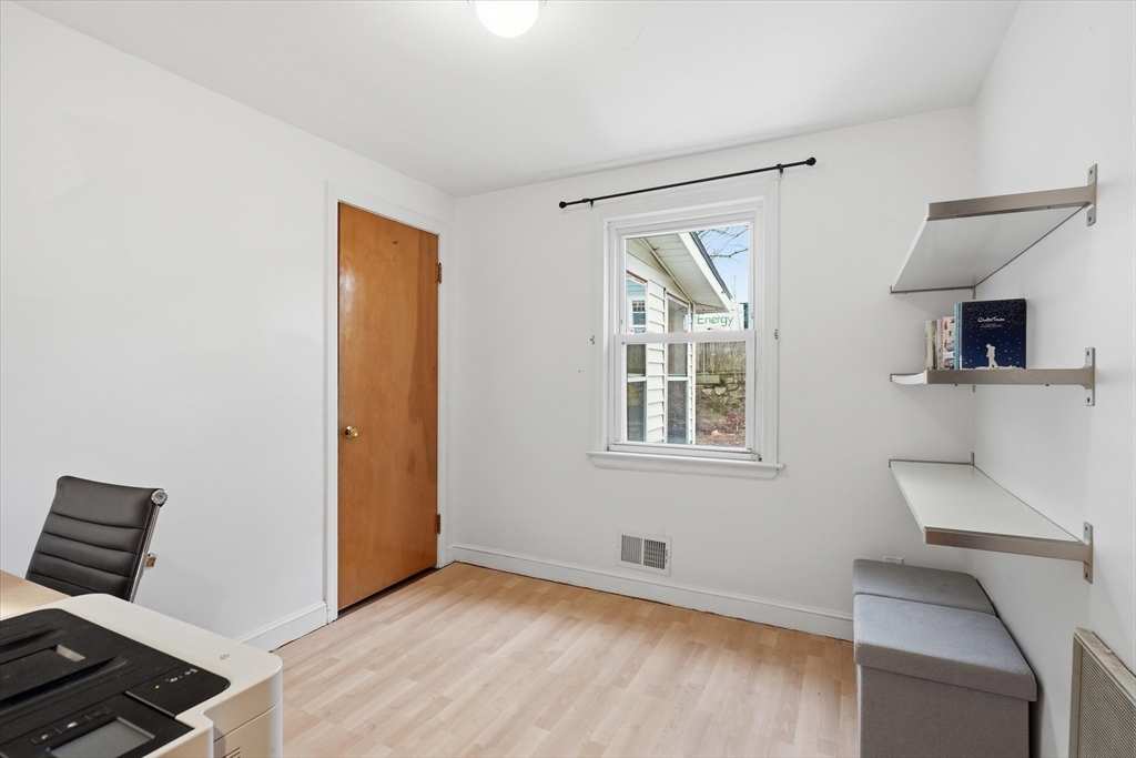 9 Pinewood Avenue Beverly, MA 01915 - Photo 16 of 41 a view of an empty room with wooden floor and a window