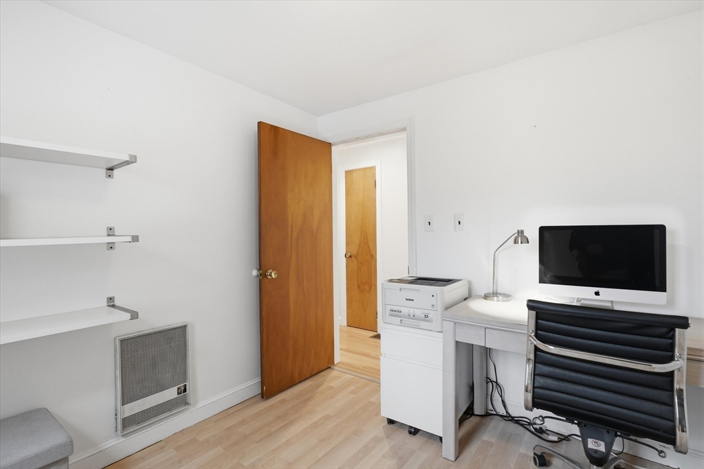 9 Pinewood Avenue Beverly, MA 01915 - Photo 17 of 41 a view of a workspace with furniture and wooden floor