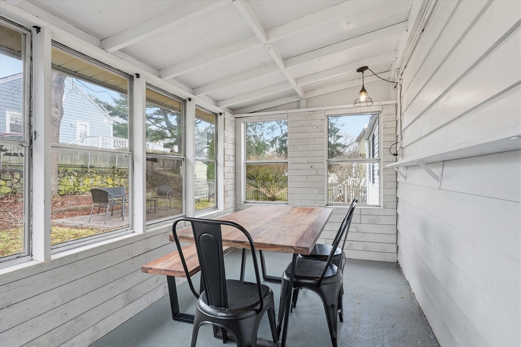 9 Pinewood Avenue Beverly, MA 01915 - Photo 26 of 41 a view of a dining room with furniture large windows and wooden floor